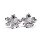 Silver floral earrings on a white background